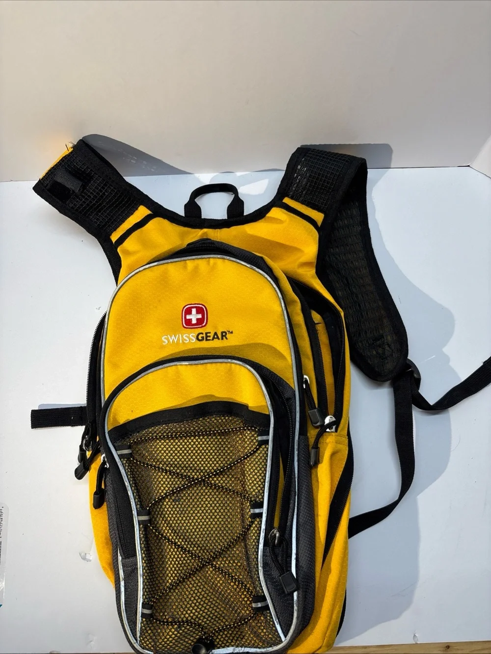 SwissGear unisex Yellow and Black Compact Daypack Backpack.